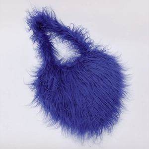 Macro detail of fluffy purple faux fur texture on this stylish heart-shaped shoulder bag