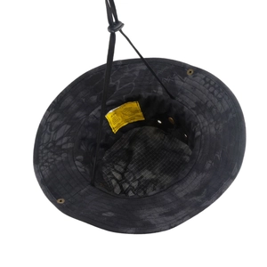 Detail of tactical boonie hat interior showing size label and adjustable chin strap