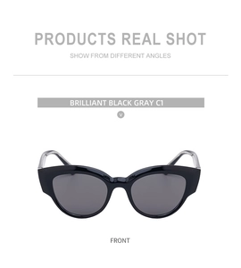 Front view of cat-eye sunglasses featuring brilliant black frames and gray lenses