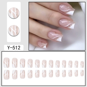 French style square press-on nails with white wavy lines and golden glitter details