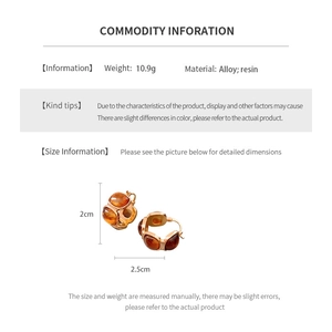 Detailed spec view of square amber resin and gold alloy drop earrings showing 2.5cm width