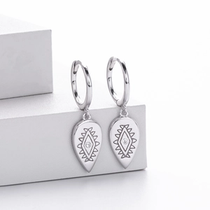 Detail of s925 silver vintage totem earrings with waterdrop pendant and small diamond inlay