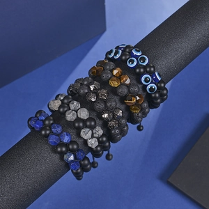 Double-layer lava stone bead bracelet with tiger eye and evil eye on display stand