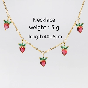 Detail of strawberry necklace with red heart-shaped crystals and 5cm extension chain