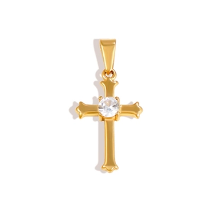 Macro shot of 24K gold plated hollow cross pendant with center sparkling crystal stone