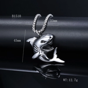 Detailed view of silver shark pendant necklace with size dimensions on black background