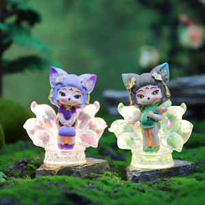Nine-tailed fox resin figurines with glowing LED bases on green moss scenery