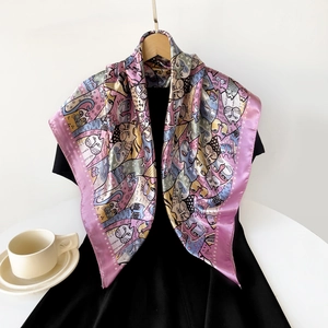 Detail of 90cm silk scarf with colorful cartoon cat pattern on a mannequin