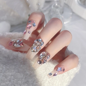 Sparkly rhinestone press-on nails in long coffin shape with pink heart and star jewels