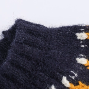Close-up of fluffy mohair knit texture on vintage crewneck sweater with blue pattern