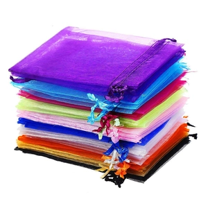 Colorful organza drawstring pouches for jewelry and gifts in various vibrant mesh colors