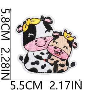 Detailed view of cartoon cow embroidered patch with specific dimensions 5.8cm by 5.5cm