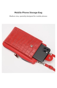 Detail of red crocodile texture phone bag showing metal snap and zippered main pocket