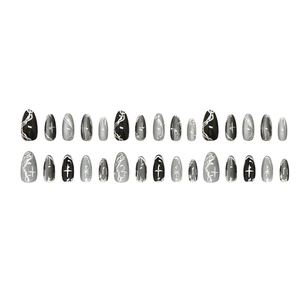 Black cat-eye press-on nails with silver starburst and marble patterns in almond shape