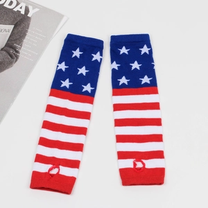 Detailed macro of American flag pattern knitted arm warmers with thumb holes on white base