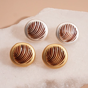 Retro geometric round stud earrings with textured enamel design in gold and silver