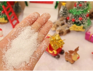 Close-up of white artificial snow powder for miniature Christmas scene decoration