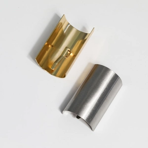 Brushed metal ponytail hook accessories in gold and silver finishes for minimalist hair styles