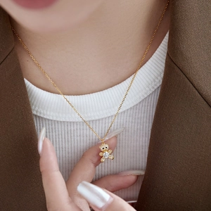 Exquisite S925 sterling silver golden bear pendant necklace with sparkling zircons on model