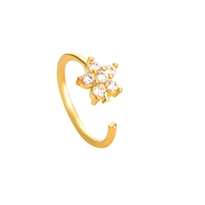 Detail of a gold nose ring with a white zircon flower design on a white background