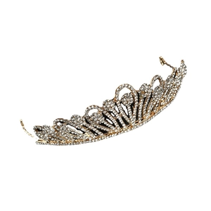 Baroque bridal crown with gold metal frame and white crystals on a white background