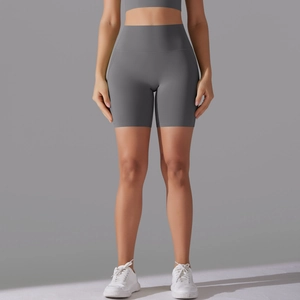 Detailed close-up of dark grey high-waisted seamless yoga shorts showing premium fabric texture
