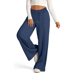 Detailed view of the drawstring elastic waistband and blue knit texture on wide-leg pants