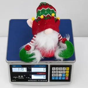Lightweight Christmas gnome plush toy on an industrial scale weighing 119 grams