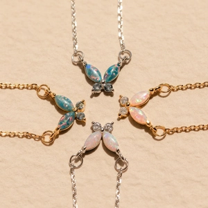 Chic butterfly opal pendant necklaces in gold and silver finish with radiant pink and blue stones