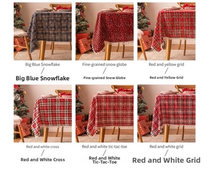 Close-up of Christmas tablecloth patterns including snowflakes and red plaid fabric details