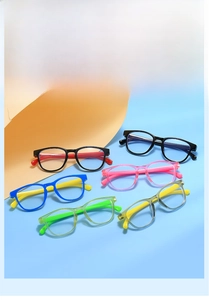 Flat lay of colorful children's anti-blue light glasses frames in various bright shades