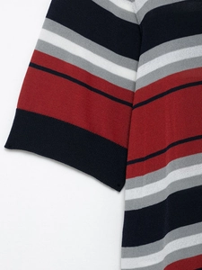 Close-up of multi-colored striped knit top showing ribbed cuff and fine texture