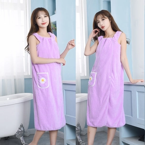 Purple microfiber wearable bath towel robe with daisy pocket shown on model in bathroom
