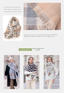 Detail of soft plaid scarf featuring rose floral prints and fine fringe tassels on fabric