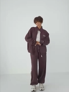 Women's two-piece tracksuit with zip-up jacket and wide-leg trousers in dark brown