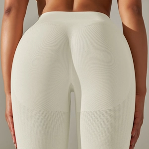 Detail of high-waisted seamless yoga pants with scrunch butt lifting texture in beige