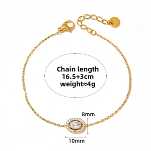 Detail showing gold stainless steel chain with 8x10mm oval crystal pendant and lobster clasp