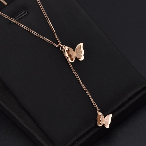 Elegant rose gold titanium Y-necklace featuring dual butterfly pendants with matte finish