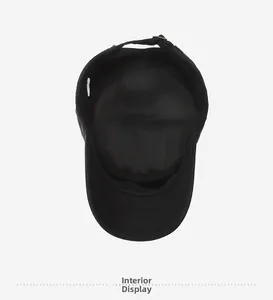 Interior view showing the stitching and washing label of this black denim flat top hat
