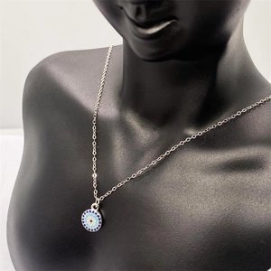 Close-up of S925 sterling silver Evil Eye pendant necklace on a jewelry display