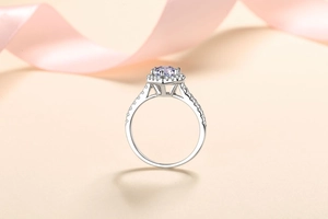 Macro detail of a heart-shaped purple gemstone ring set in polished silver claws