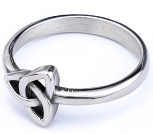 Macro detail of silver stainless steel Celtic knot ring with vintage polished finish