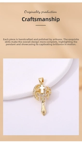 Macro shot of gold cross pendant with dragon motif and pavé cubic zirconia inlay