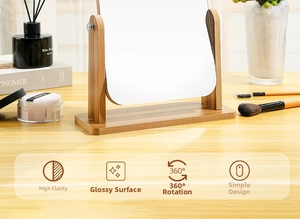 Rotating tabletop wooden makeup mirror with a natural finish frame in a cozy home setting