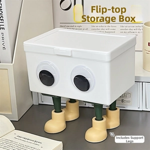 Weiße Klappdeckel-Aufbewahrungsbox mit Comic-Augen und dekorativen gelben Stiefelbeinen