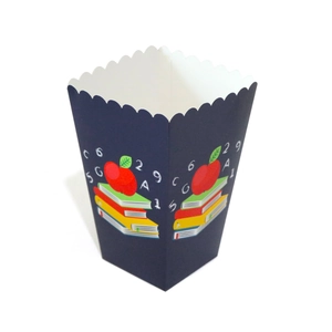Detail of scalloped edge popcorn box with school theme books and apple pattern