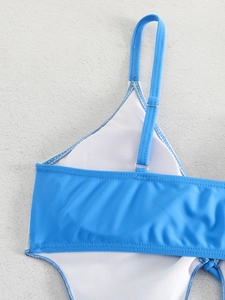 Detailed close-up of sky blue bikini with adjustable strap and silver metal buckle