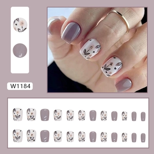 Short ballet press-on nails in dusty purple and grey with floral leaf patterns