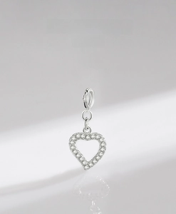 Detailed macro view of S925 sterling silver heart charm with pavé setting and lobster clasp