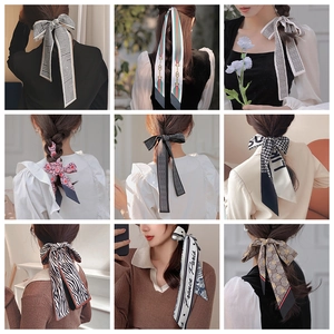 Collage of printed silk hair scarves featuring diverse geometric and floral patterns